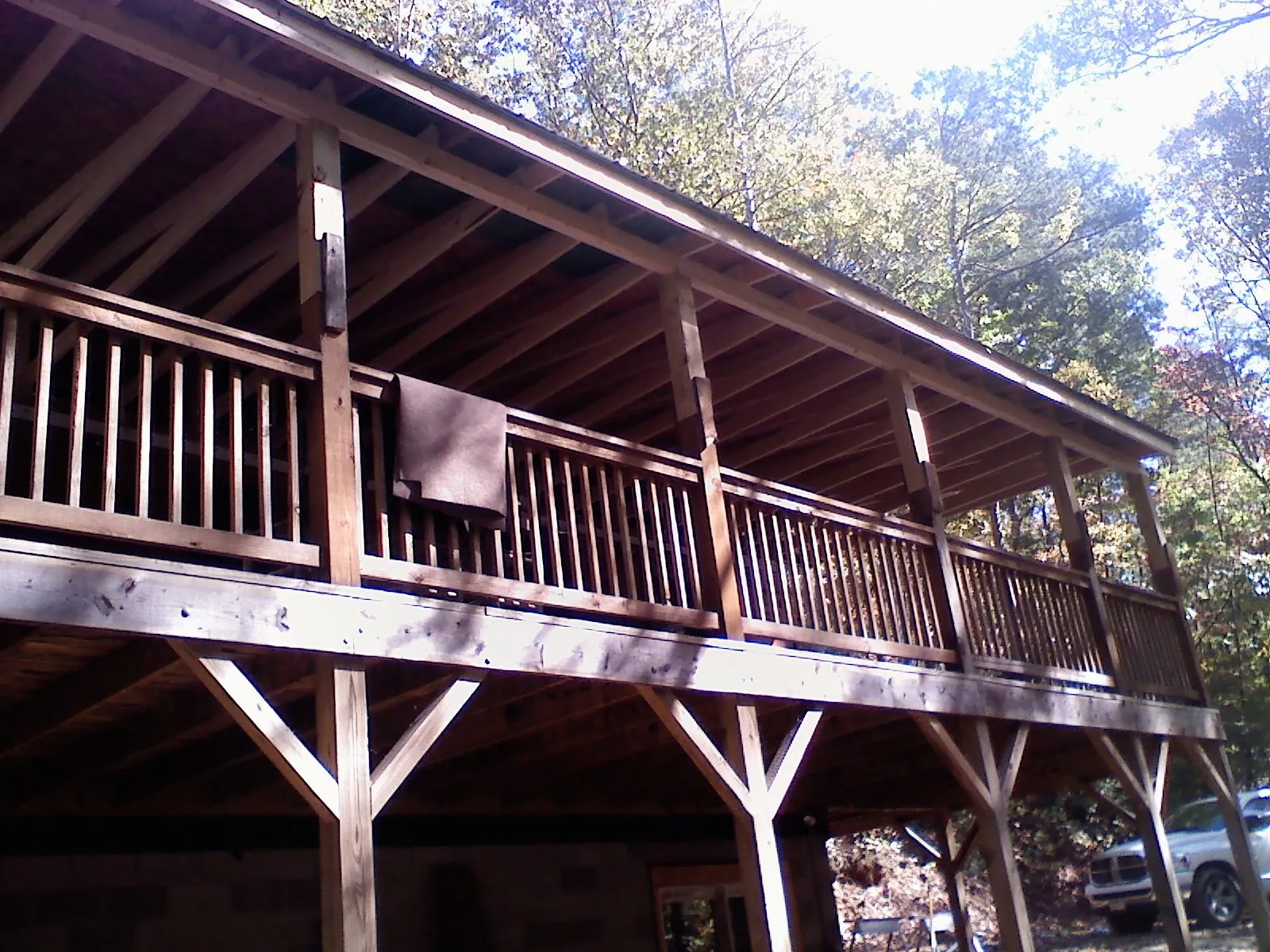 Timber framing under a new elevated porch and deck — Roof Leak Repair in Oneida by Roofing Brothers